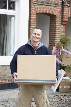 Removal team sorting recyclable items for reuse and disposal in Richmond upon Thames