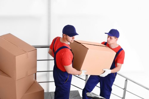 Removal crew securing items safely inside a moving vehicle