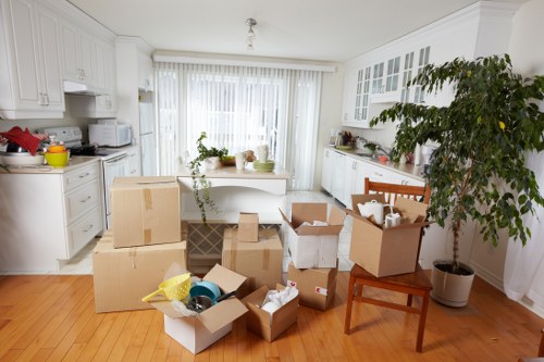 Packed boxes and furniture being prepared for a student move