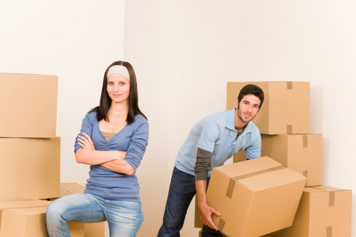 Professional movers loading boxes and furniture for a local relocation