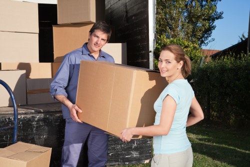 Removal van loading boxes and household items in southwest London