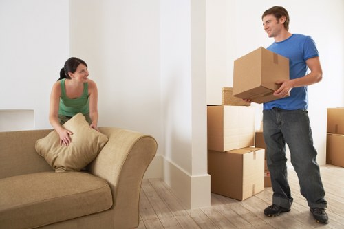 Helper carrying items at a Richmond Upon Thames flat move